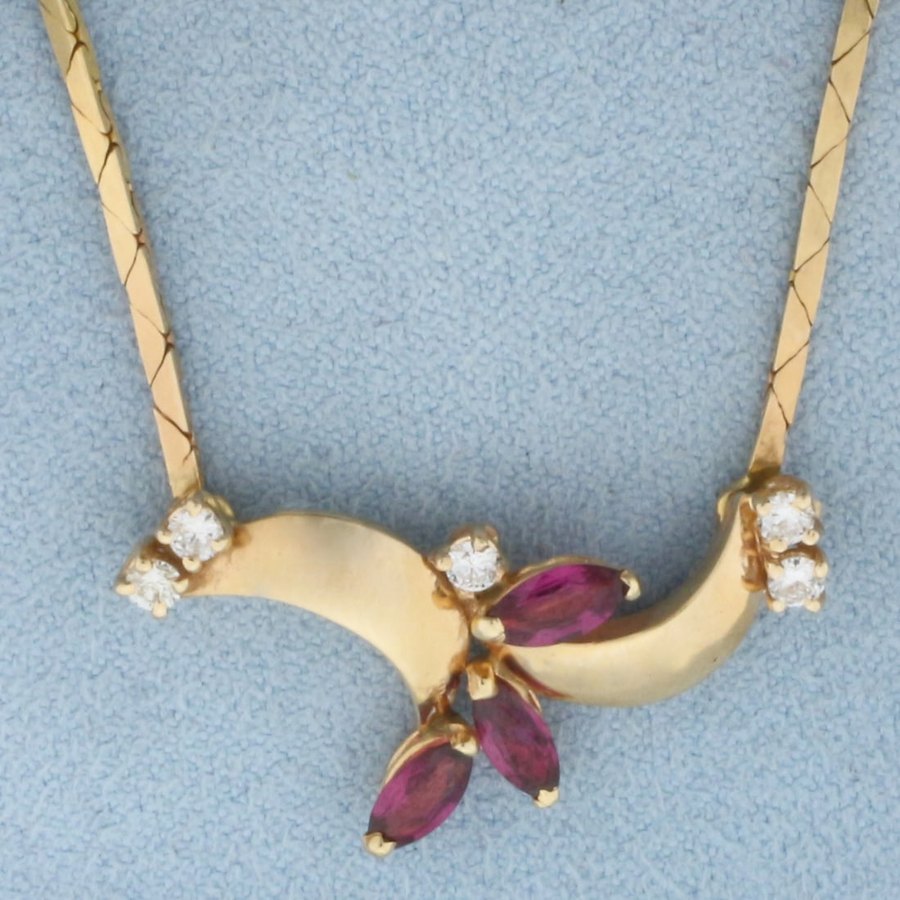 A ruby and diamond gold necklace